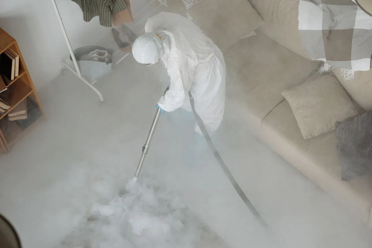 Biohazard cleanup technician in protective equipment, Riverhead, NY